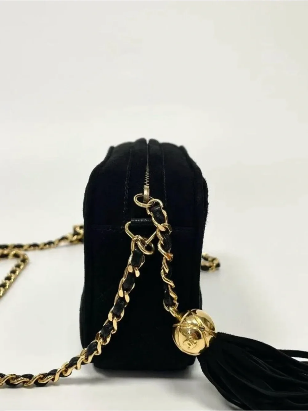 CHANEL Black Quilted Crossbody Bag with Gold Chain and Tassel
